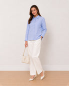 Ava sky blue Oxford cotton oversized shirt, angled front view with patch pocket