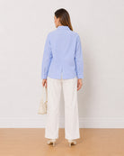 Ava sky blue 100% cotton oversized shirt back view with the centre back slit