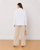 Ava white 100% cotton oversized shirt back view with the drop shoulder seams