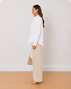 Ava white Oxford cotton oversized shirt side profile with the side slit