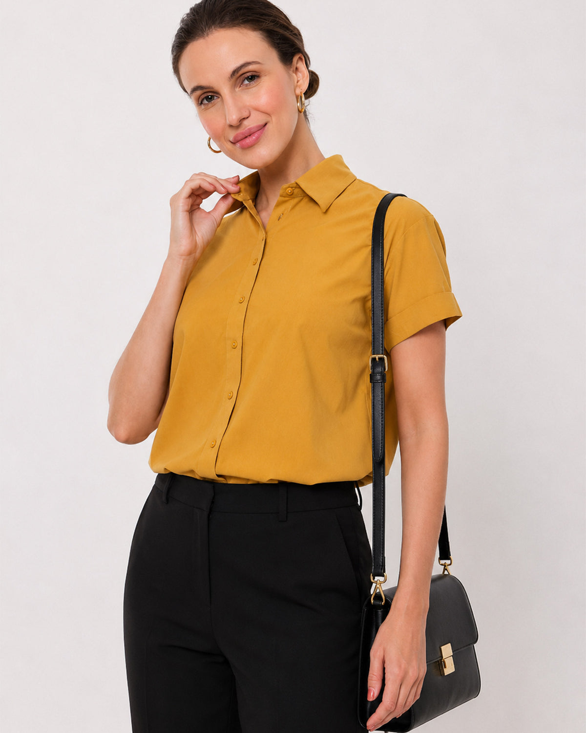 Avony mustard yellow half sleeves shirt waist up front with the turn-up cuffs