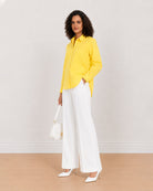 Bali bright yellow cotton poplin shirt, angled front view with drop shoulder and full sleeves