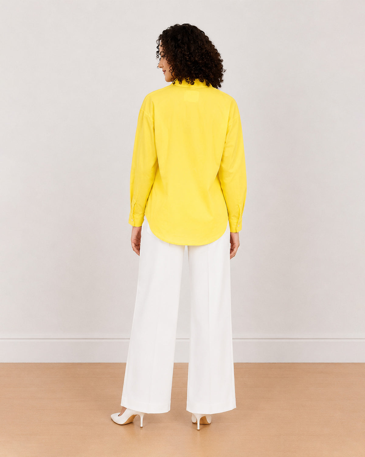 Bali bright yellow cotton shirt back view with drop shoulder and the long curved hem