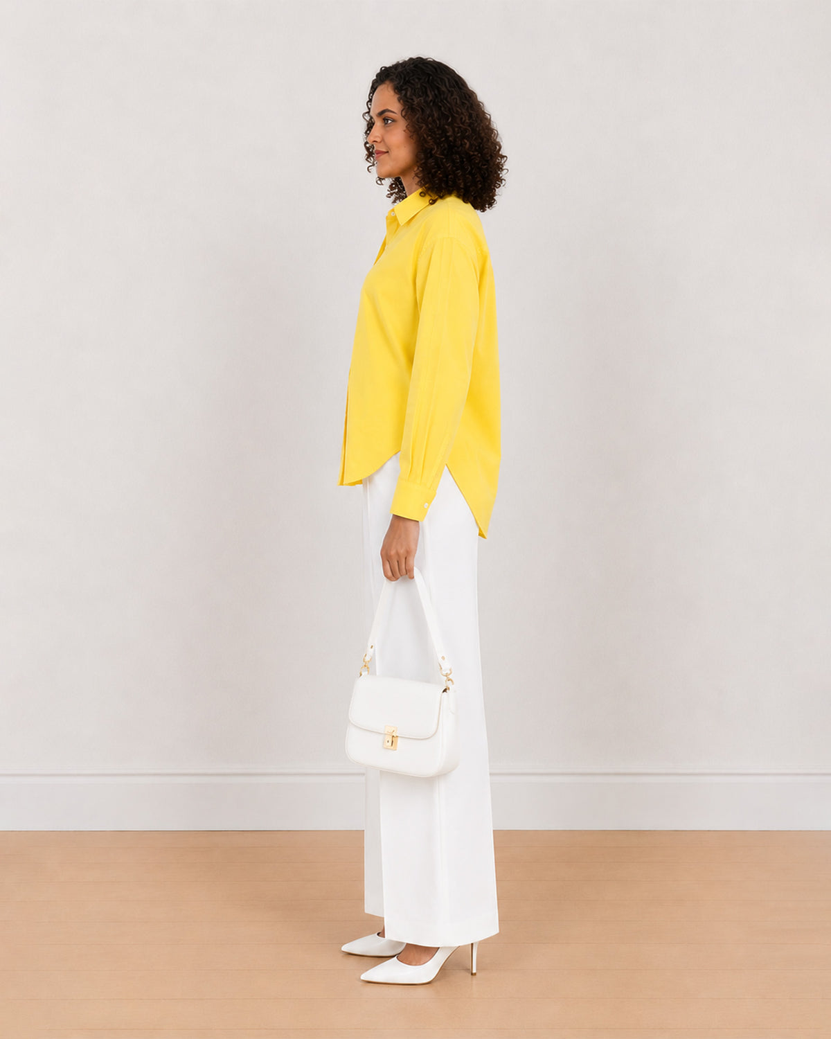 Bali bright yellow 100% cotton shirt side view with the long length and curved hem