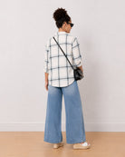 Barbara powder blue checks shirt back view with the long curved hem and drop shoulder