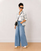 Barbara powder blue checks oversized shirt worn open, front view with the drop shoulder