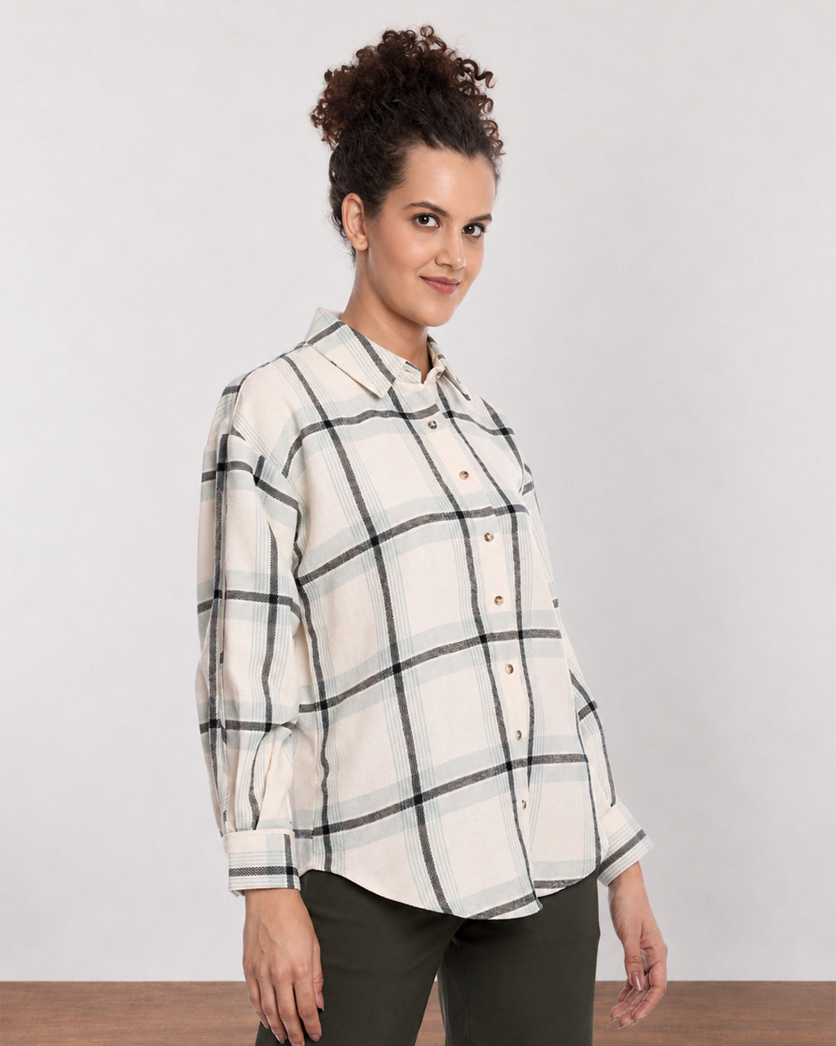 Barbara sage green brushed cotton checks shirt, angled front view with the curved hem