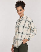 Barbara sage green checks oversized shirt, angled waist up view with the drop shoulder