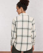 Barbara sage green checks shirt back view with the long curved hem and drop shoulder