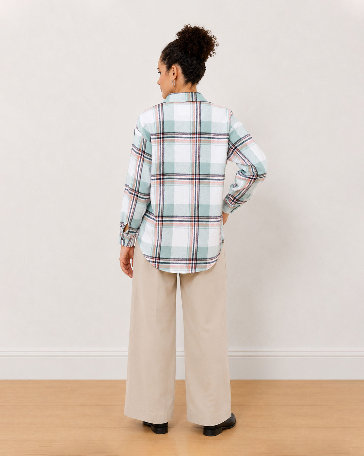 Beatrice sage green checks shirt back view with the long curved hem and drop shoulder