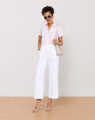 Becky pink and white striped cotton shirt worn loose, front view of the formal fit