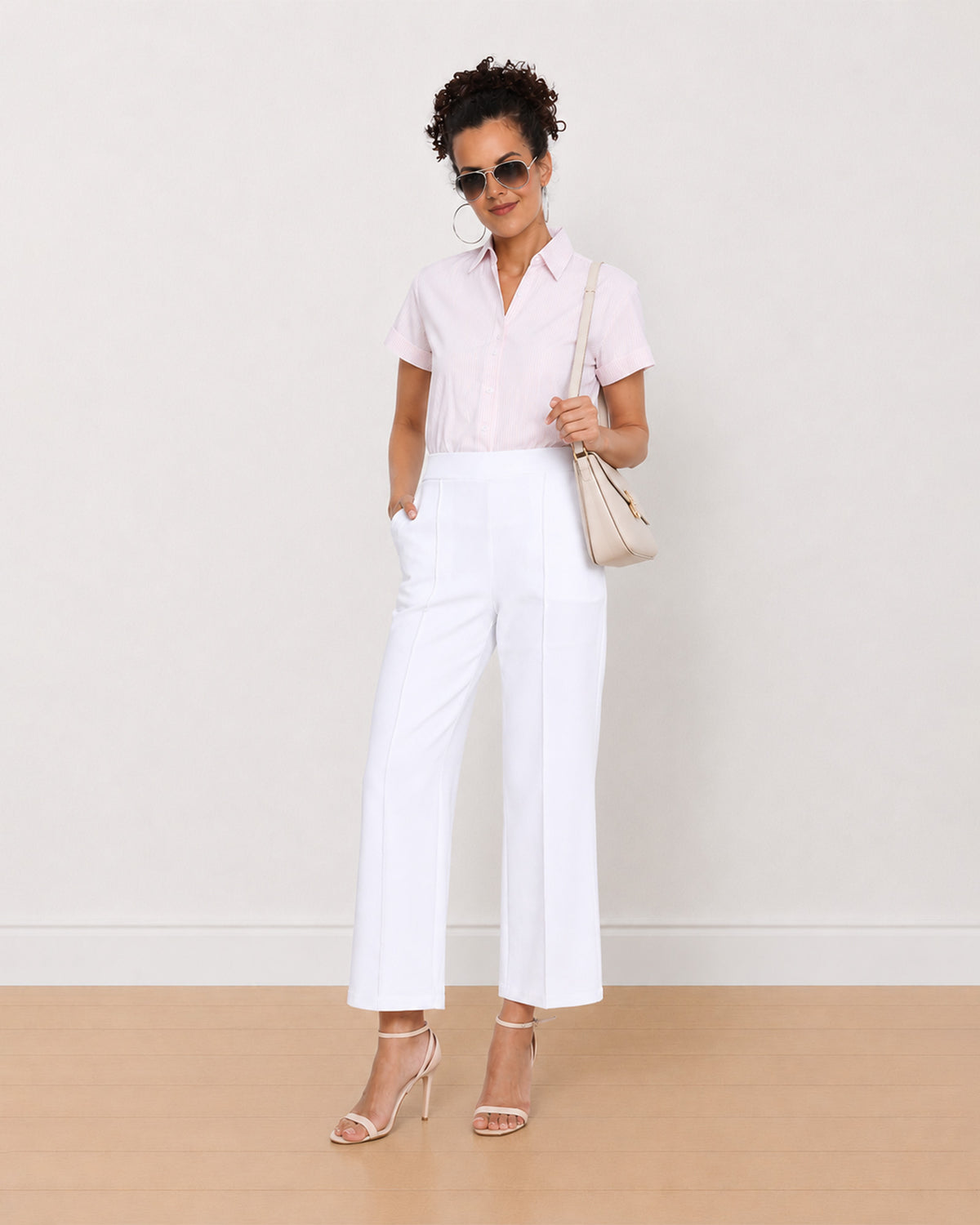 Becky pink and white striped cotton shirt worn loose, front view of the formal fit