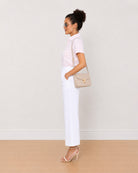 Becky pink and white striped shirt side view with the curved hem