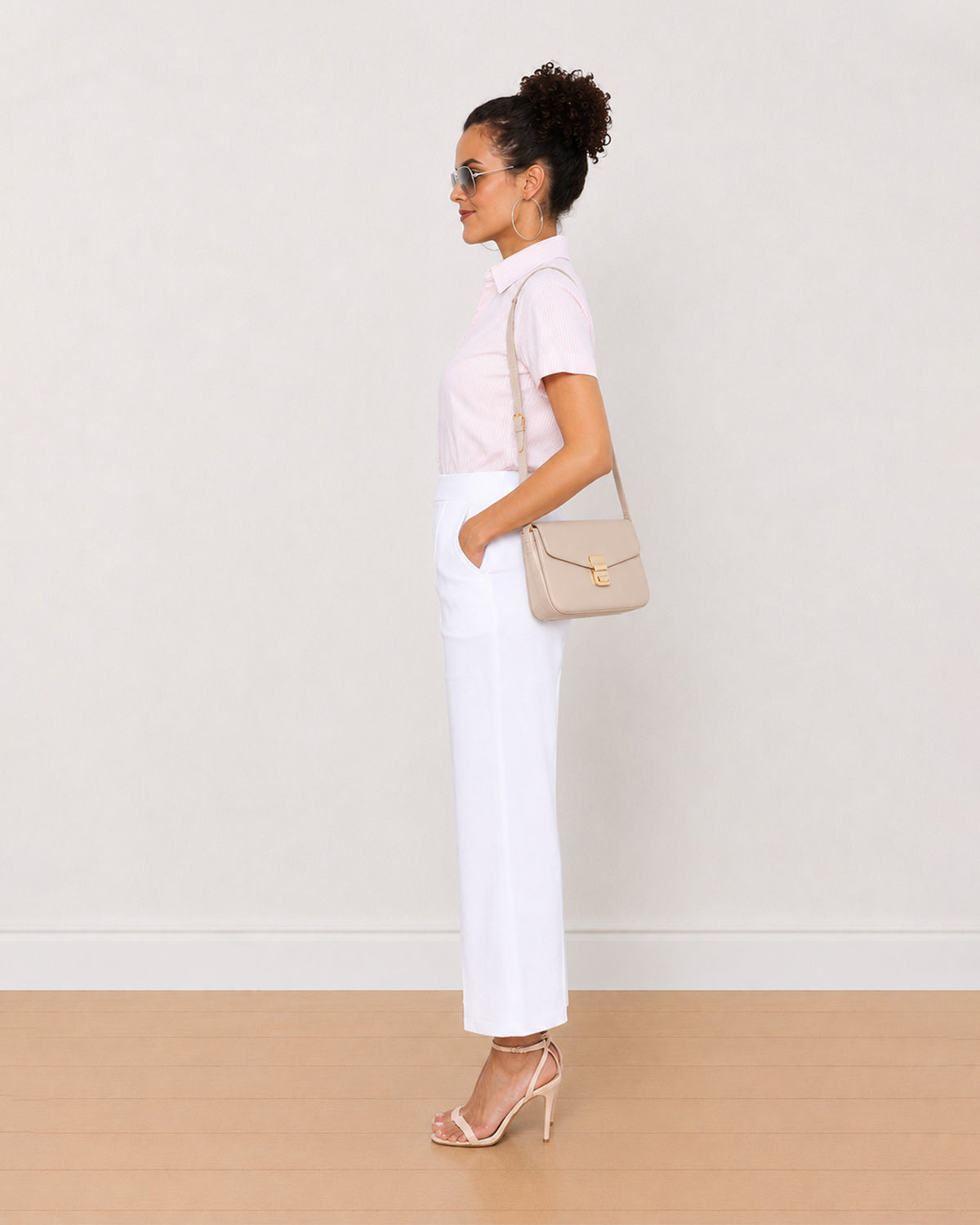 Becky pink and white striped shirt side view with the curved hem