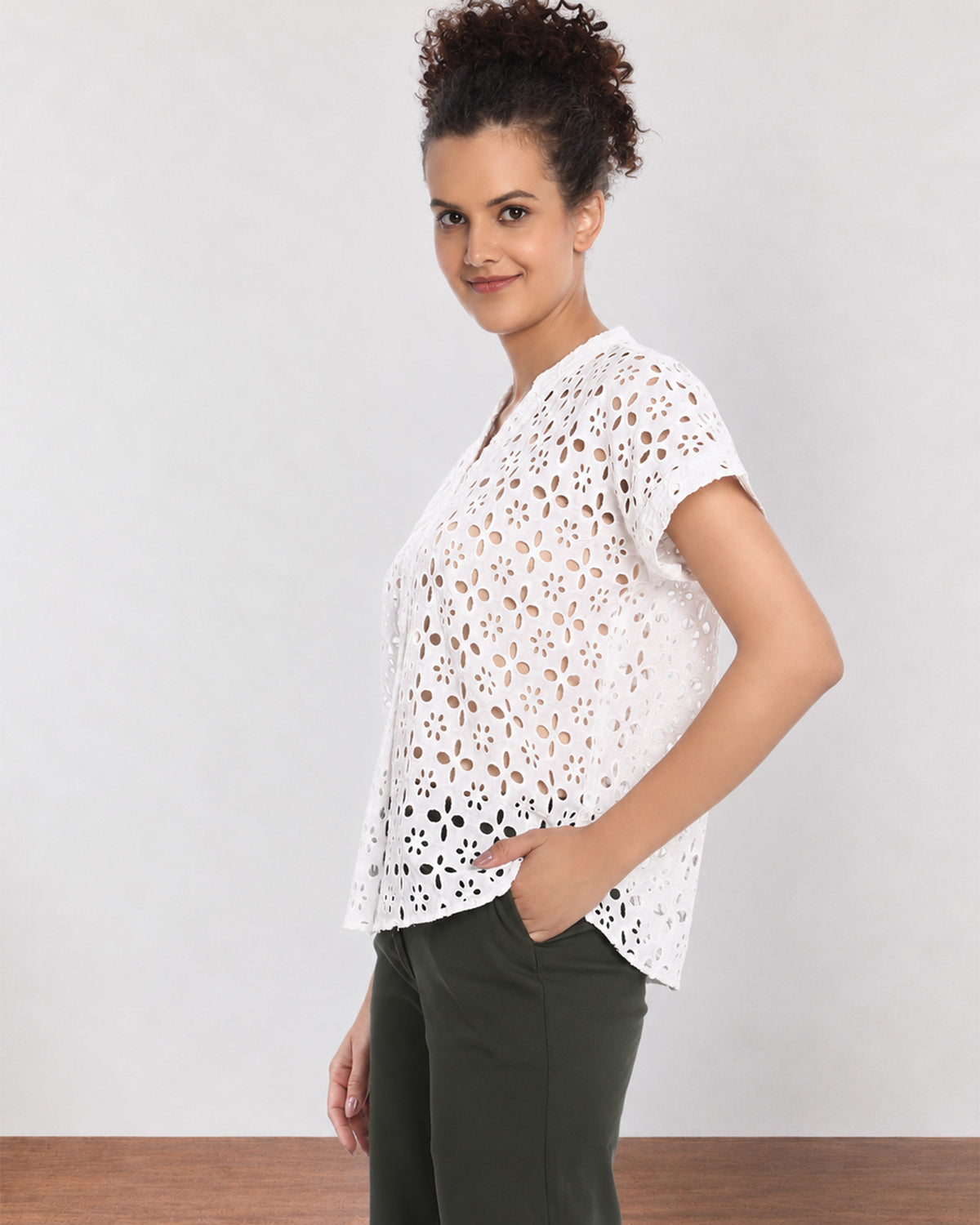 Belinda white schiffli lace top, angled front view with boxy fit and extended shoulders
