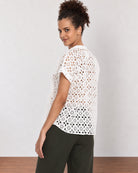 Belinda white schiffli cutwork lace top back view with the boxy fit and curved hem