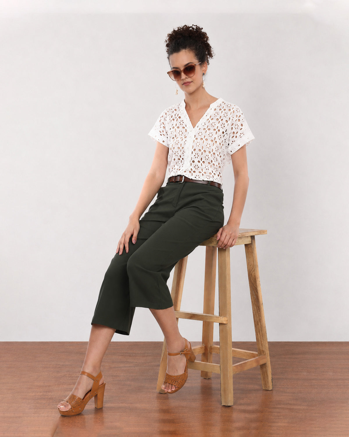 Belinda white schiffli cutwork lace top, seated full length view with stand collar