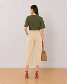 Bella beige 3/4th straight pants back view with the medium waist and straight leg
