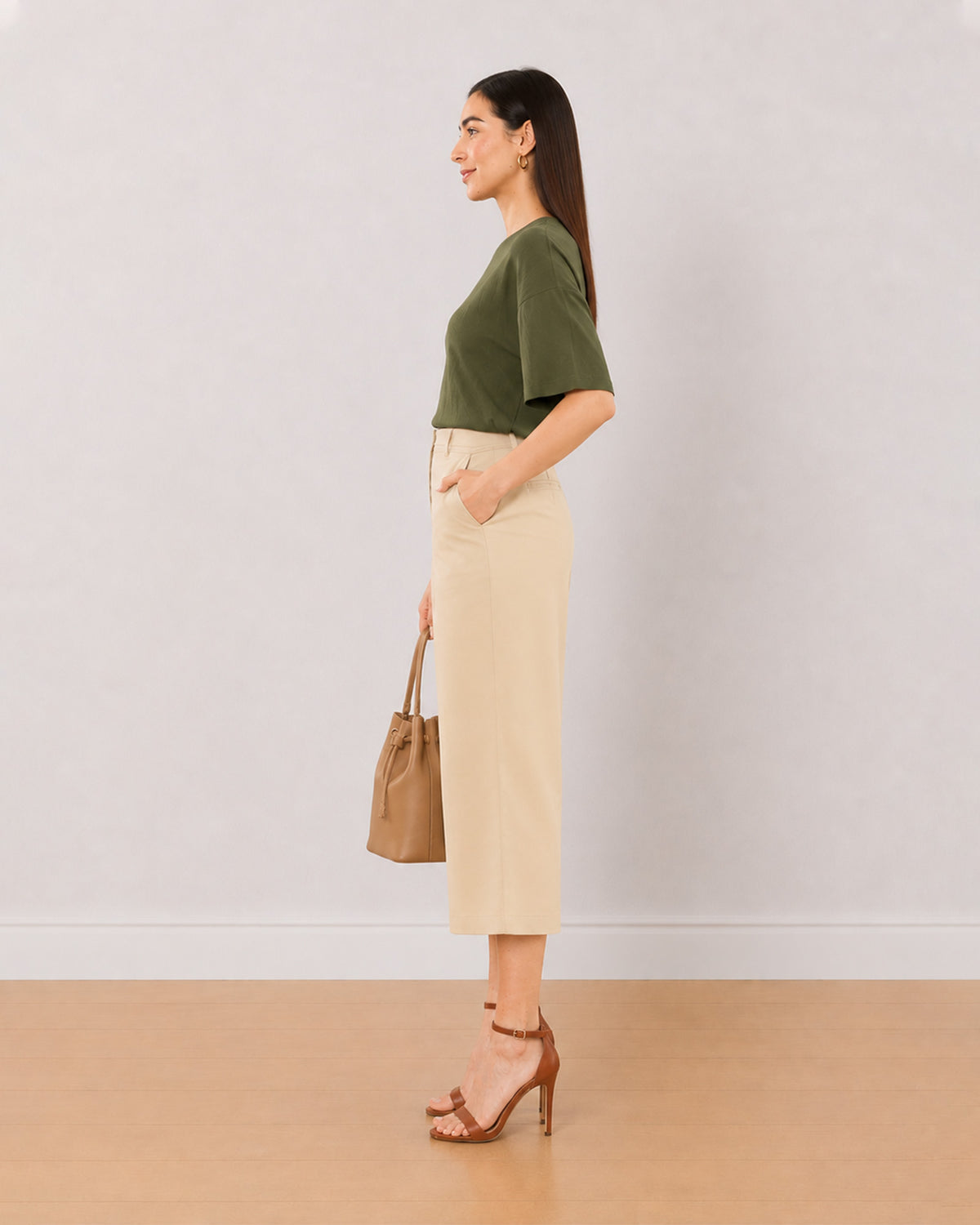 Bella beige medium waist 3/4th straight pants, side view with the mid calf hem