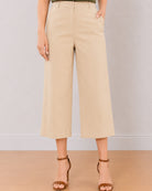 Bella beige medium waist pants front detail with belt loops and 2 side cross pockets