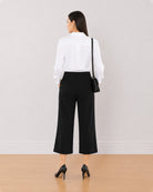 Bella black 3/4th straight pants back view with the medium waist and straight leg