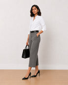 Bella grey 3/4th straight pants front view with a hand in the side cross pocket