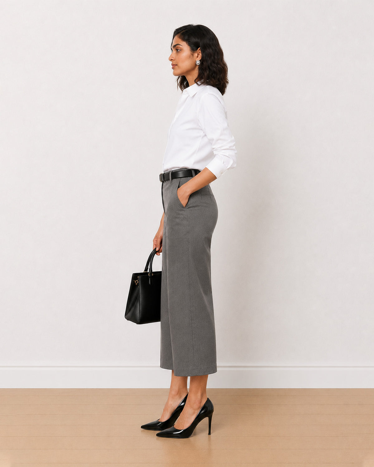 Bella grey medium waist 3/4th straight pants, side view with the mid calf hem