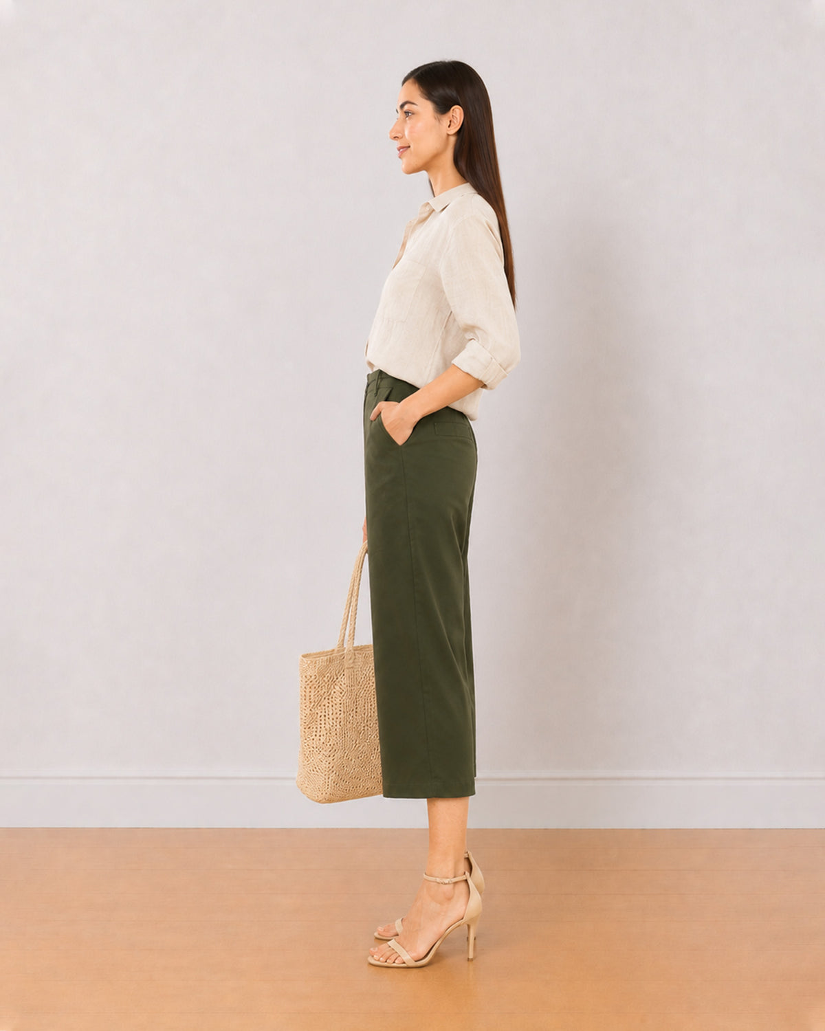 Bella olive green medium waist 3/4th straight pants, side view with the mid calf hem