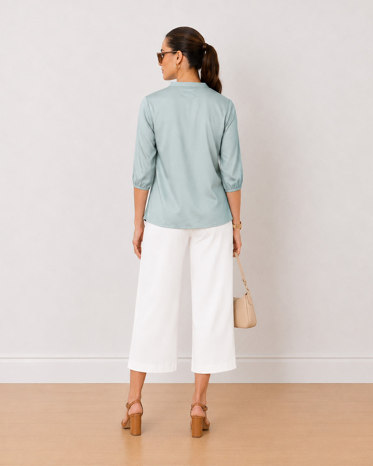 Bellina sage green twill viscose top back view with the boxy fit and long length