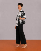 Benna black and white floral print oversized shirt, angled front view with the long hem