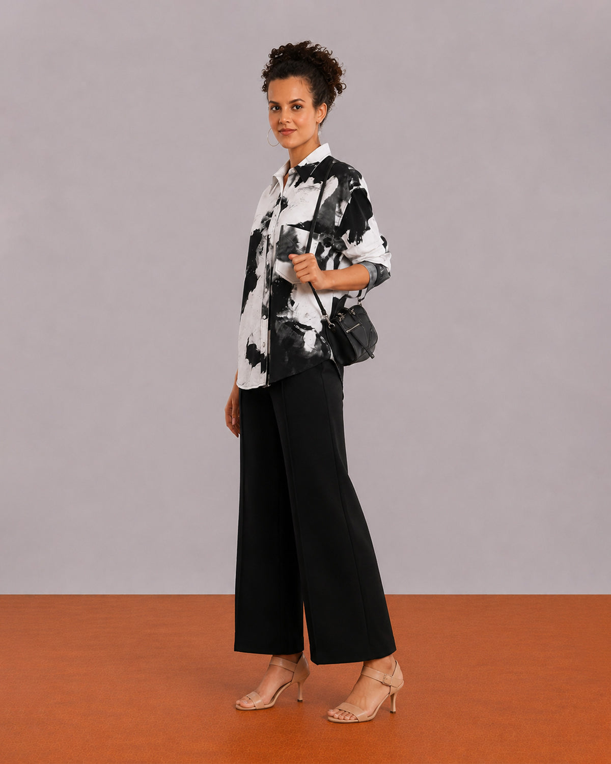 Benna black and white floral print oversized shirt, angled front view with the long hem