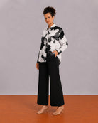 Benna black and white floral print oversized shirt worn loose, front view of the relaxed fit