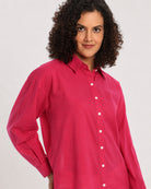 Berry bright pink shirt, angled waist up view with the drop shoulder and full sleeves