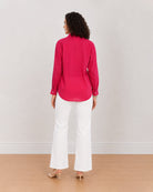 Berry bright pink cotton poplin shirt back view with the long curved hem