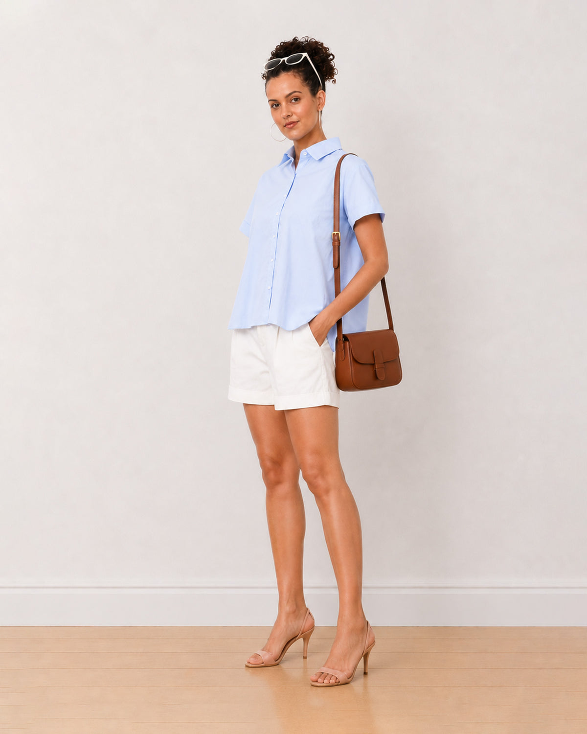 Bershka sky blue oxford cotton shirt worn loose, front view of the plus size friendly boxy fit