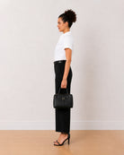 Bershka white oxford cotton shirt side view with the curved hem and boxy fit