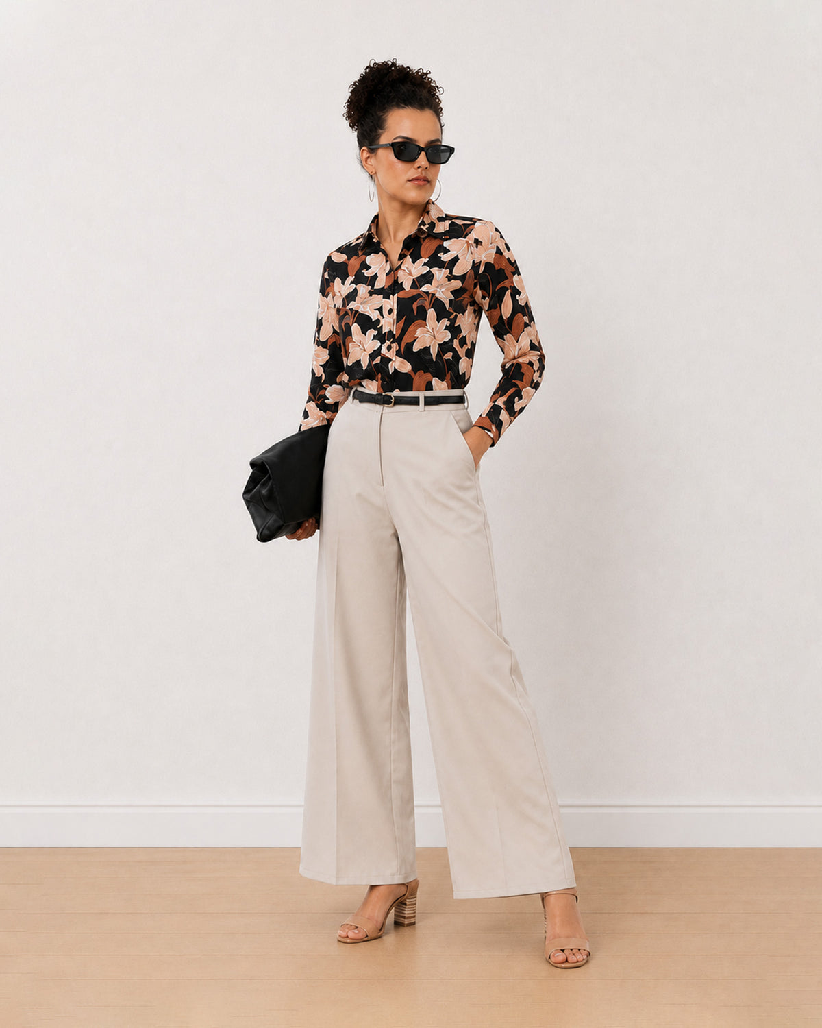 Bethany black floral print cotton shirt, angled front view with the curved hem