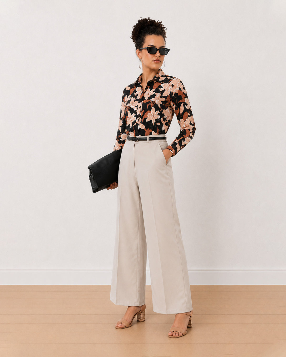 Bethany black floral print shirt worn loose, front view of the relaxed fit
