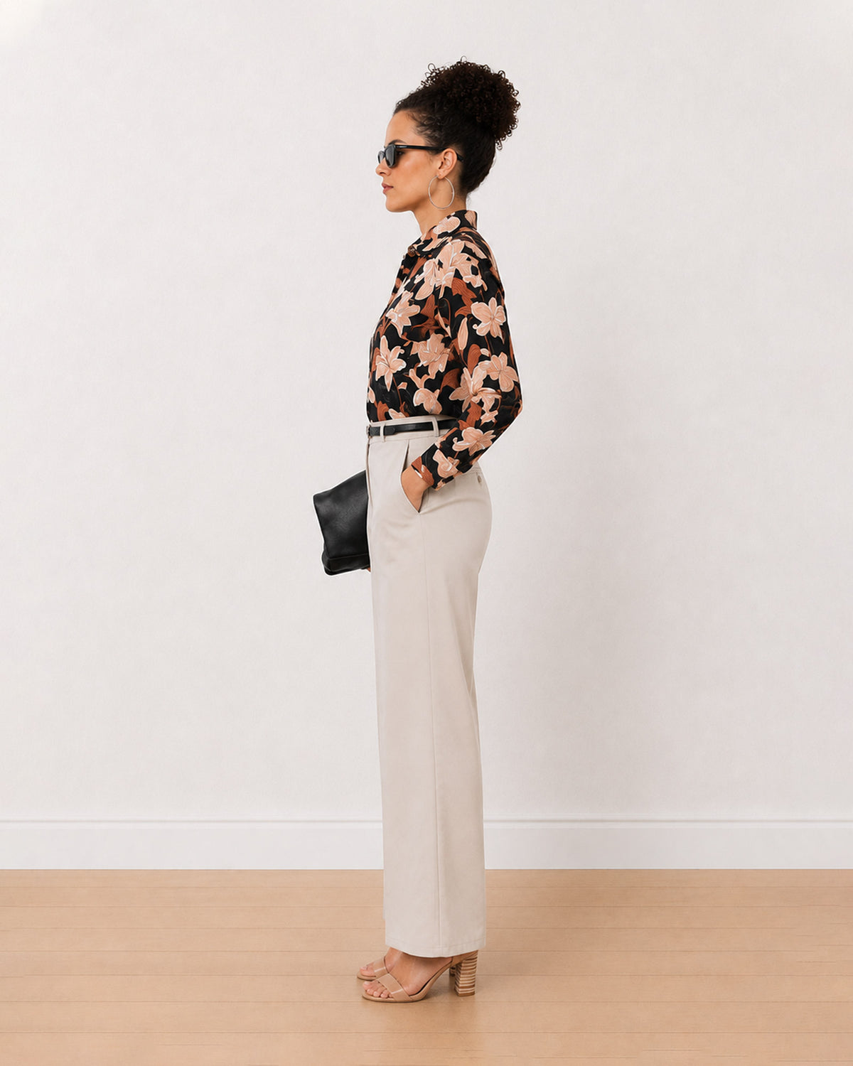 Bethany black floral print cotton shirt side view with the curved hem