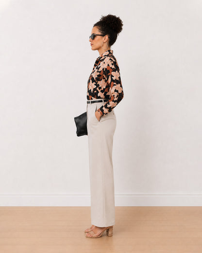 Bethany black floral print cotton shirt side view with the curved hem