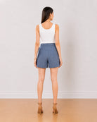 Blair denim blue high waisted summer shorts back view with the mid thigh hem