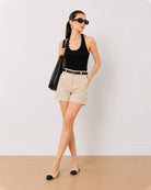 Bobby beige loose fit summer shorts, front view at the mid thigh length
