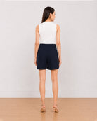 Bobby navy blue medium waist shorts back view with the mid thigh hem