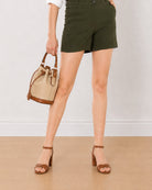 Bobby olive green shorts, angled waist down view of the mid thigh length