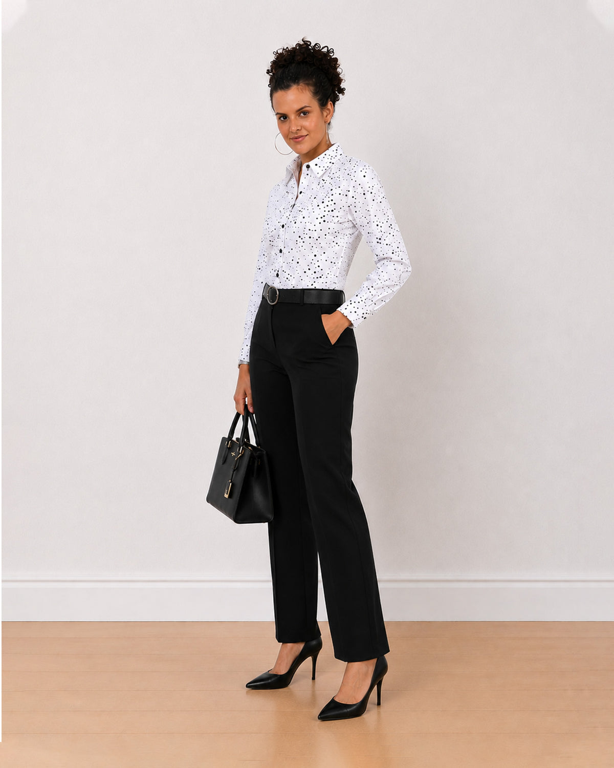 Brenda black and white polka dots print shirt worn loose, front view of the long length