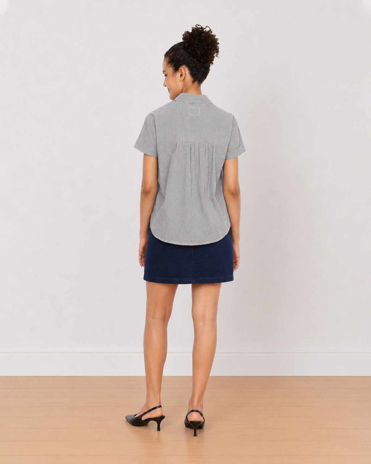 Bronze black and white striped shirt back view with gathers at the back yoke