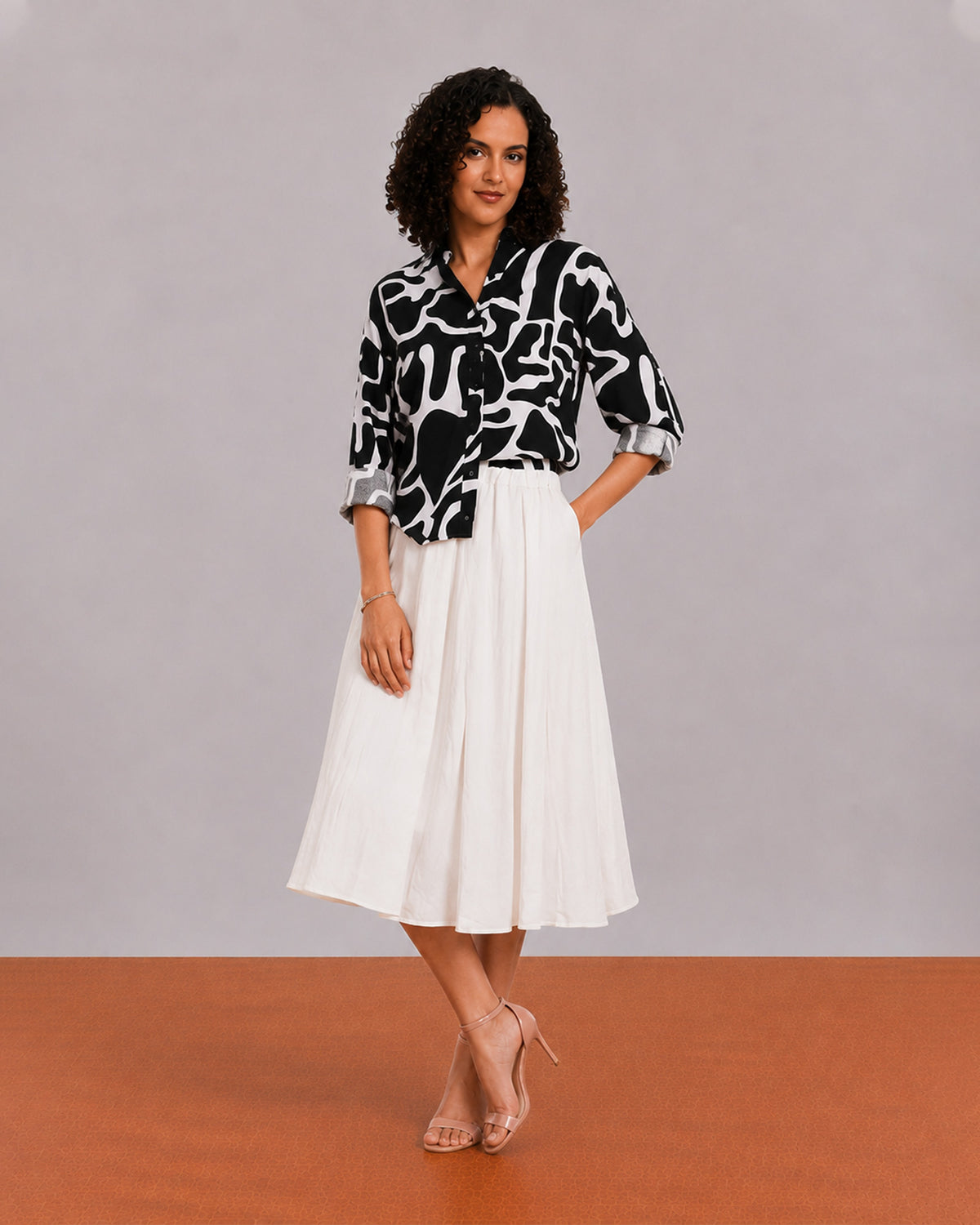 Brooke black and white abstract print viscose linen shirt worn loose, front view