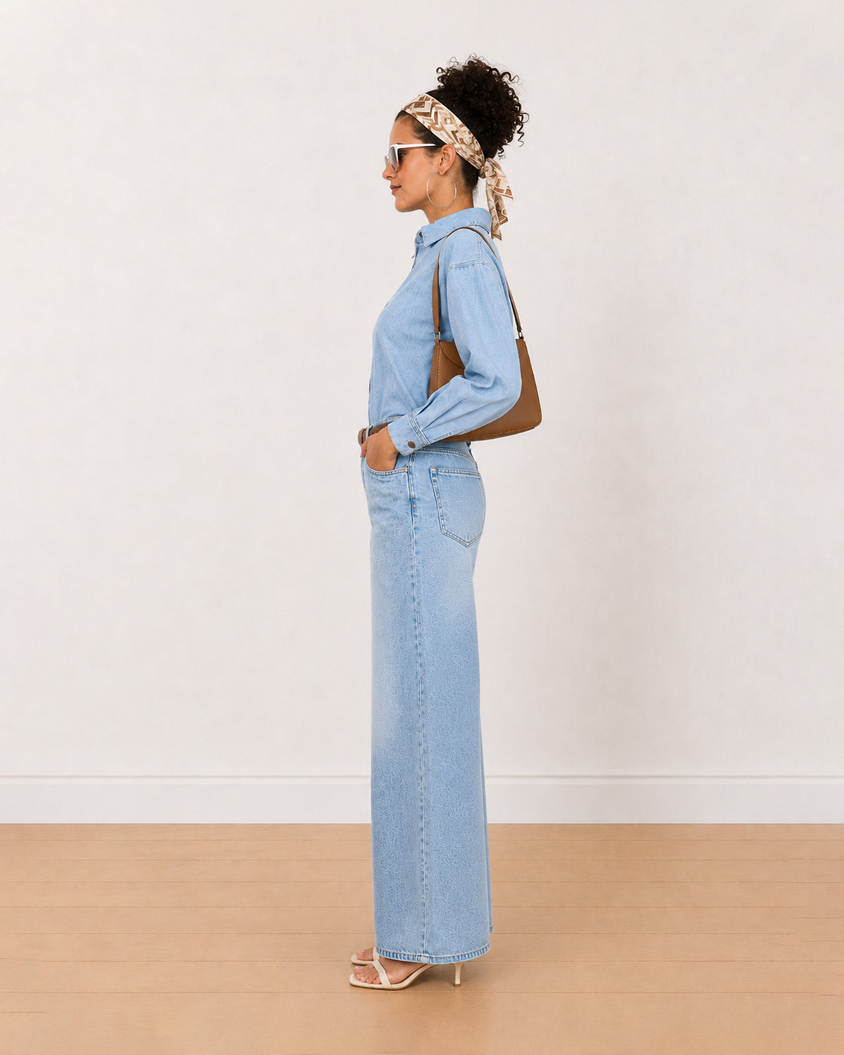 Brynn light blue denim shirt side view with the frayed hem