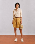 Caleb light grey formal shirt front view with full sleeves rolled up and hem tucked in