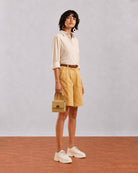 Side view of Caleb light grey viscose linen shirt showing relaxed fit and rolled sleeves